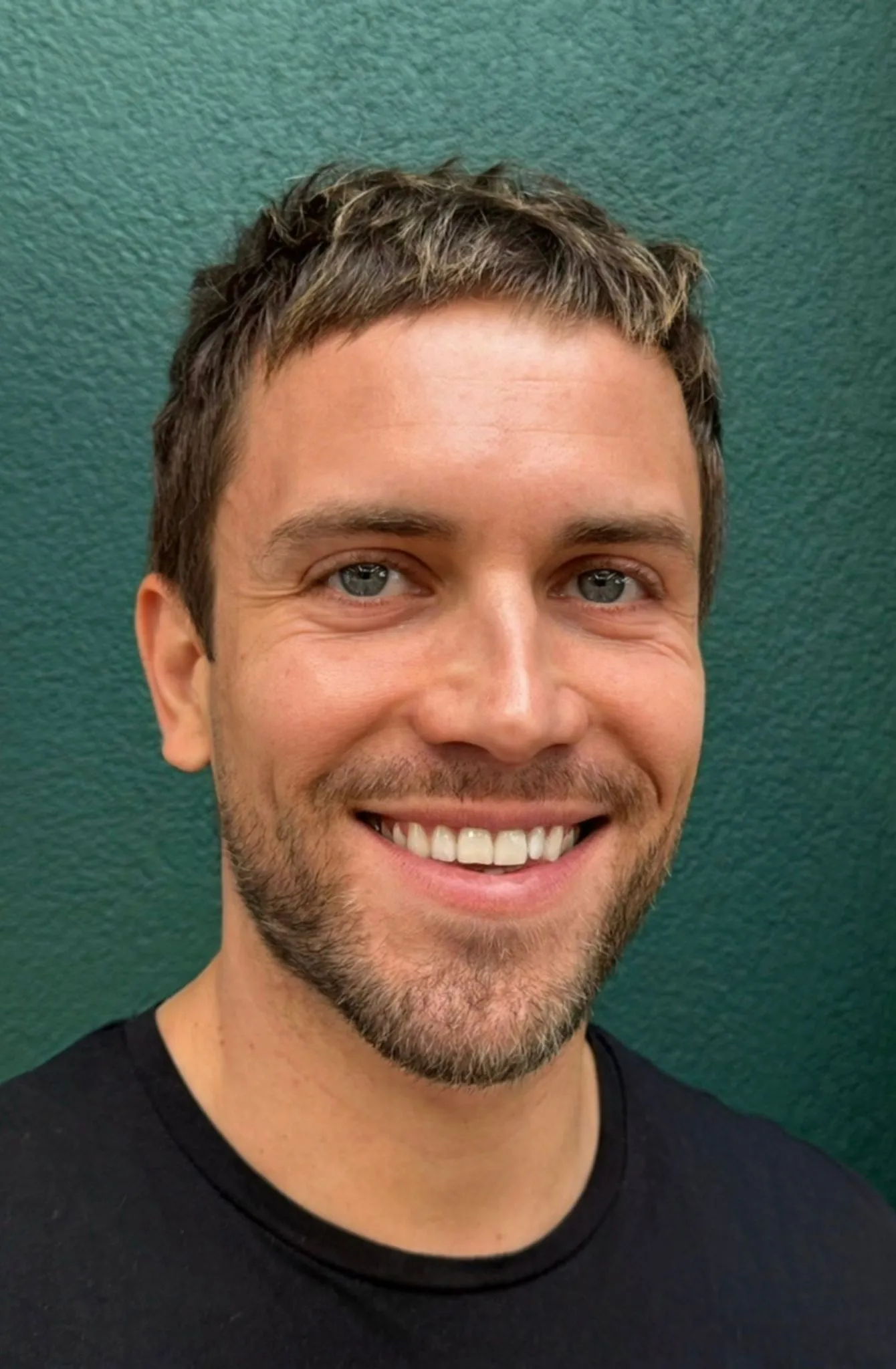 Portrait of Zoltan smiling.
