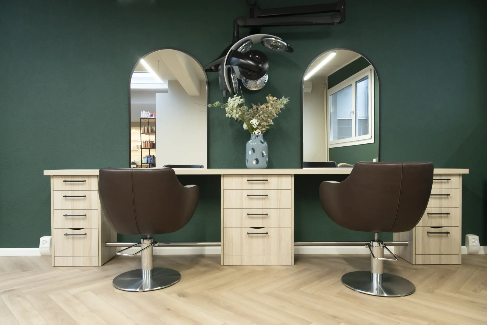 Wide interior view of the salon showing a calm, modern professional space.